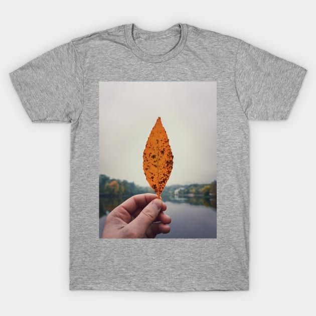 hand holding yellow leaf T-Shirt by psychoshadow